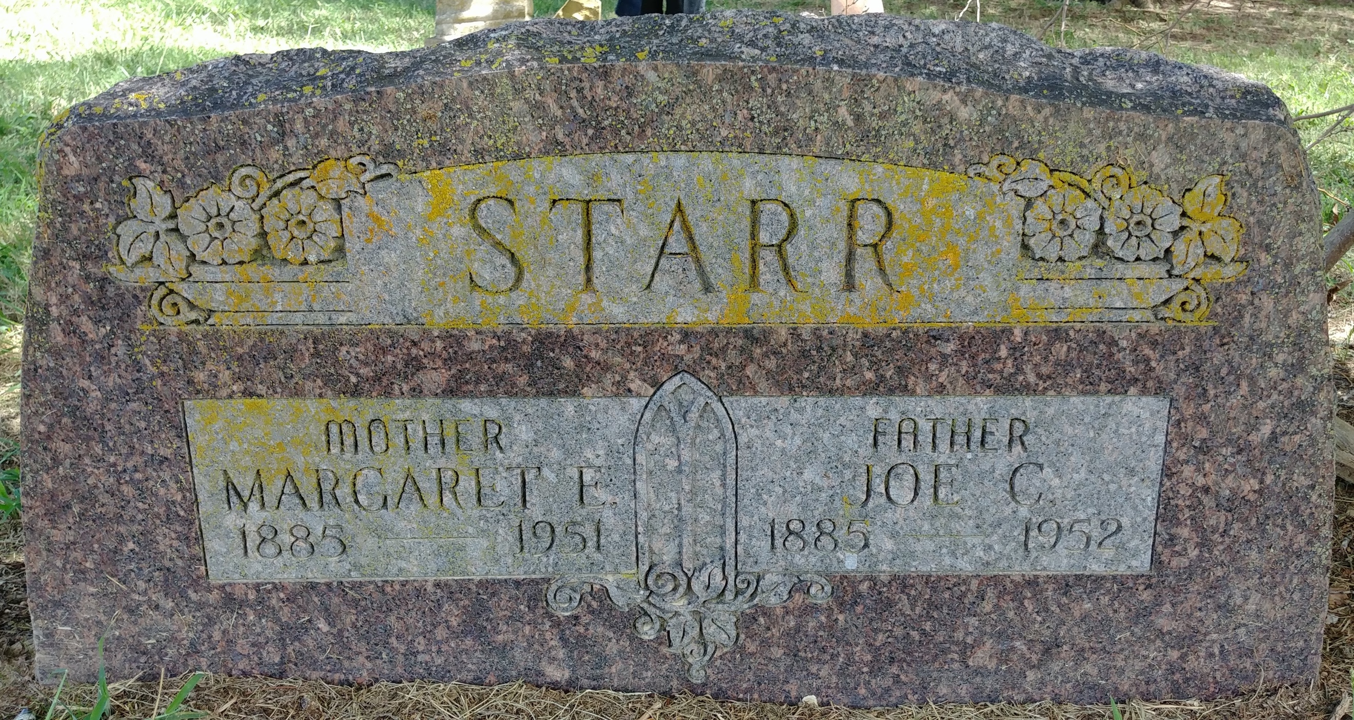 A close-up of a tombstone  Description automatically generated